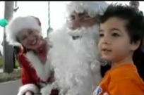 Dylan Mathewson, 4, of Daytona Beach, meets Santa in New Smyrna Beach.